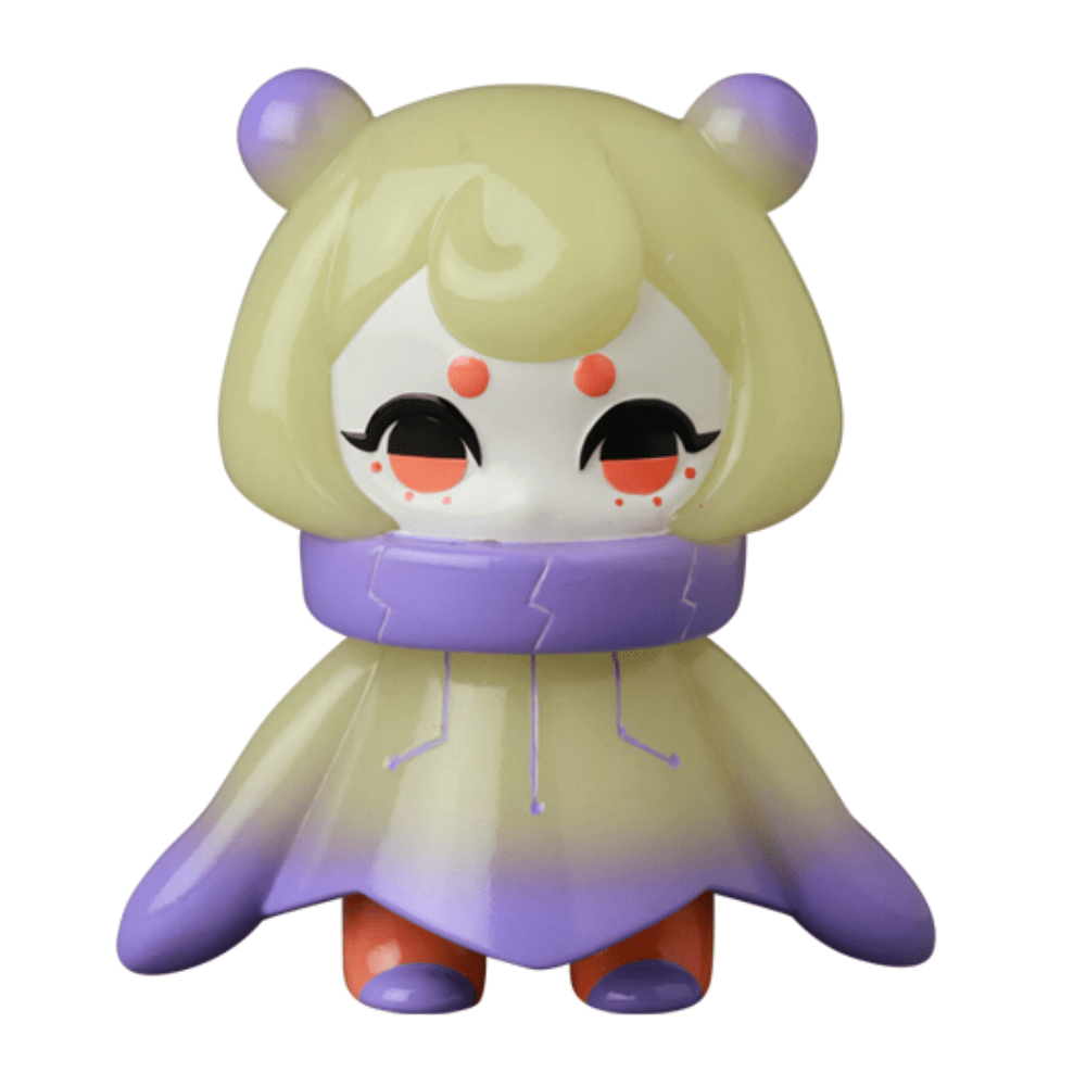 The VAG 10th Anniversary — Denshikodako by Medicom (JP) is a Japanese vinyl toy with a round head, bear-like ears, large eyes with red dots above them, and a gradient purple-and-cream cloak—ideal for gachapon collectors.