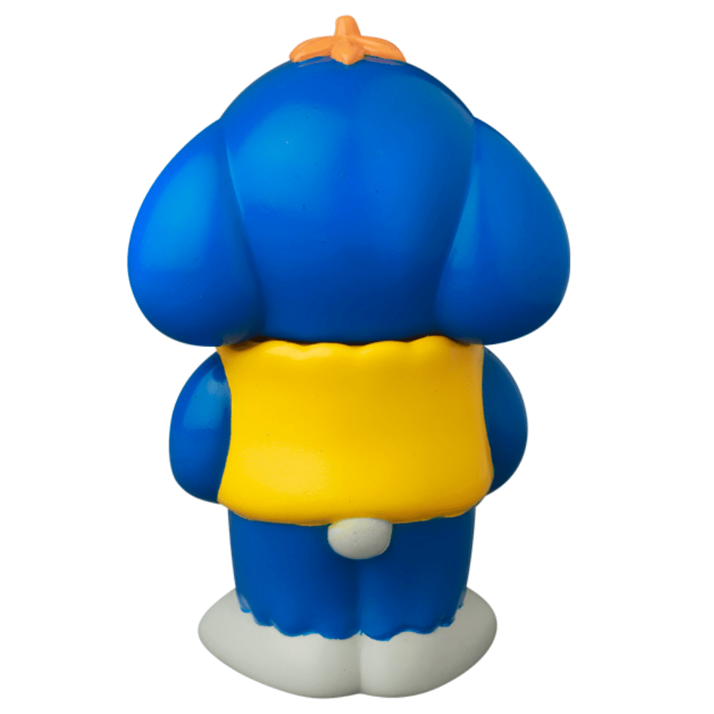 The VAG 43 — Uluru by Medicom (JP) features a blue cartoon character with large ears, a yellow vest, and a white tail, shown from the back against a white background—a cute Japanese vinyl toy inspired by gachapon figures.
