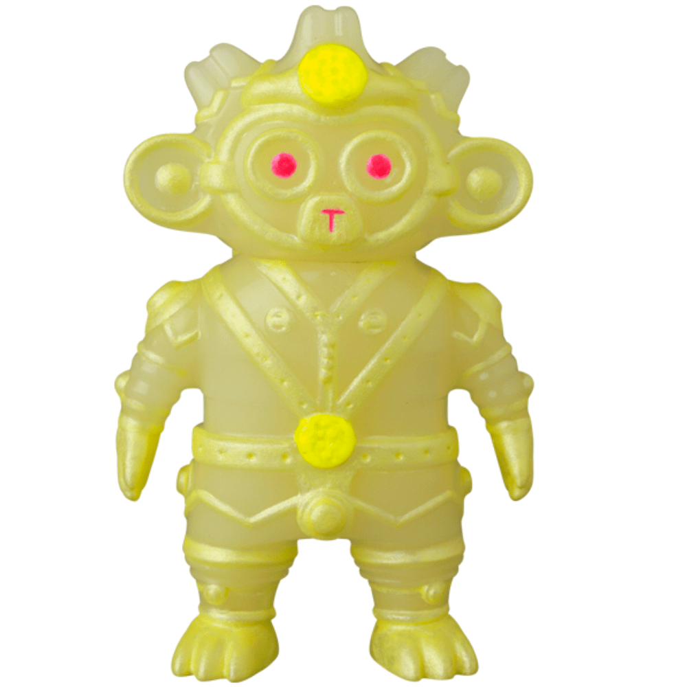 VAG 34 - Tomodachi Second Machine by Medicom (JP): a yellow, humanoid monkey toy with pink eyes, circular chest details, a suit, helmet, and gloves—an ancient Machine with a gentle soul ready for new adventures.