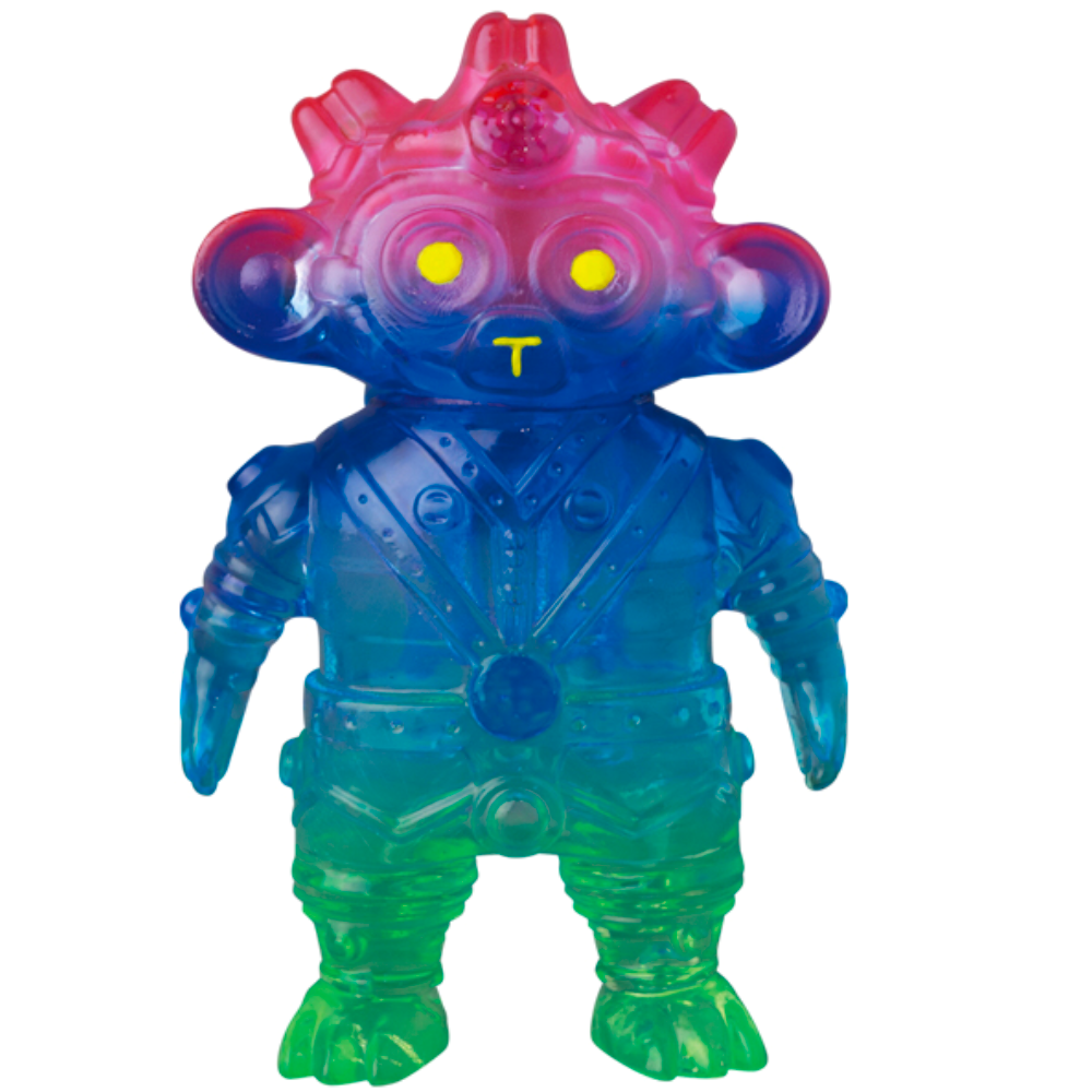 The VAG 34 - Tomodachi Second Machine by Medicom (JP) is a multicolored toy figurine featuring a gentle humanoid alien with large ears, glowing yellow eyes, and a suit-like body inspired by an ancient machine.