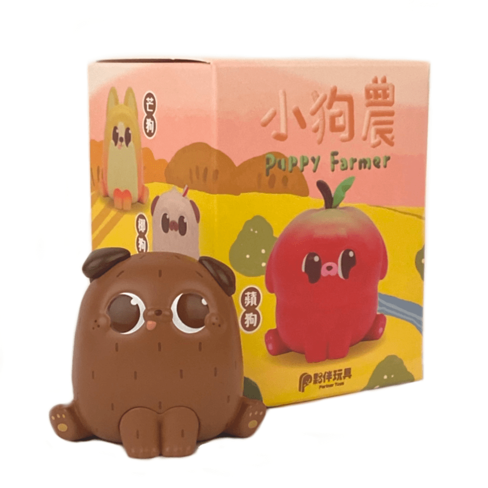 A brown cartoon-style dog figurine from the Puppy Farmer - Blind Box by Partner Toys sits before a colorful box with playful apple puppy and apple character illustrations. Each box contains a random design for extra surprise!.