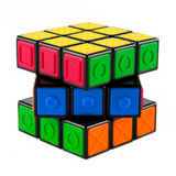 The Spinmaster Rubik's CNIB SmartLife Sensory Cube is a tactile puzzle designed for visually impaired users, featuring raised shapes—circles, crosses, dots, and textured patterns—on its colored tiles.