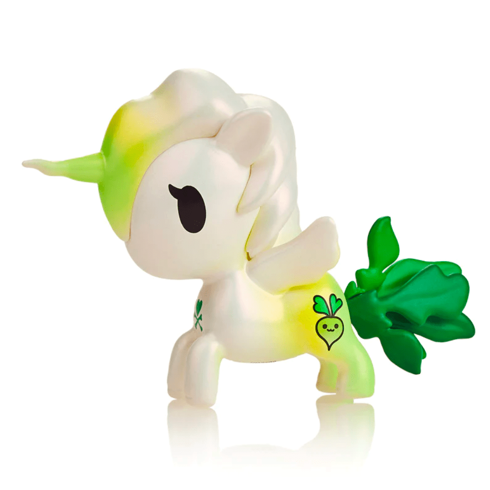 A white Tokidoki Veggie Unicorno - Daikon Special Edition Figure with a green mane, tail, and a Daikon radish symbol on its side, isolated on a white background.