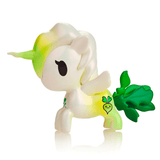 A white Tokidoki Veggie Unicorno - Daikon Special Edition Figure with a green mane, tail, and a Daikon radish symbol on its side, isolated on a white background.
