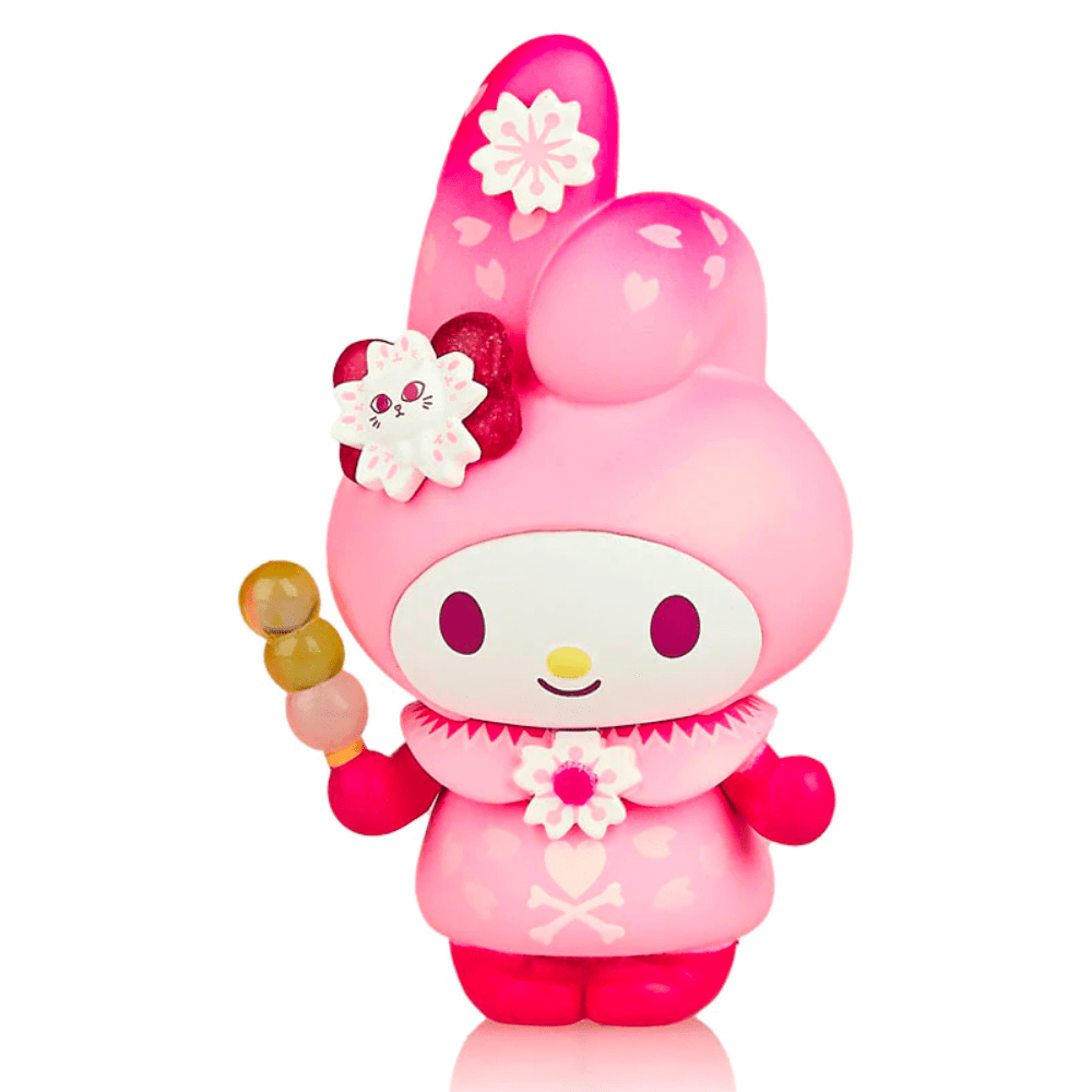 A pink vinyl collectible figure from the tokidoki Hello Kitty X Tokidoki - Series 3 Blind Box, representing a cute character with stylized bunny ears, adorned with flowers, and holding a wand.