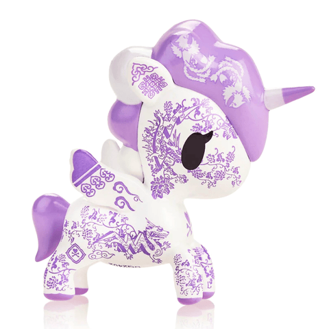 Sentence with replaced product: TokiDoki Porcellana Unicorno unicorn figurine with lavender motif, isolated on a white background.