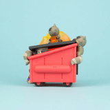 Two Trash Panda vinyl toy pandas dressed as construction workers peering out of a Dumpster Fire against a pale blue background by 100% Soft.