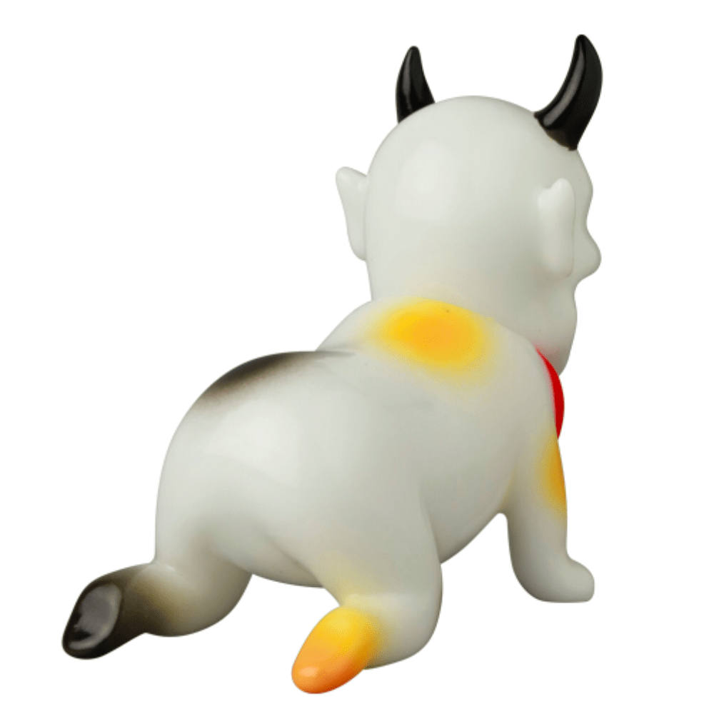 Medicom (JP) VAG 10th Anniversary — Sebastian: a Japanese vinyl animal toy with black horns, red collar, yellow and orange spots, shown from the back on all fours—a must-have for gachapon figure collectors.