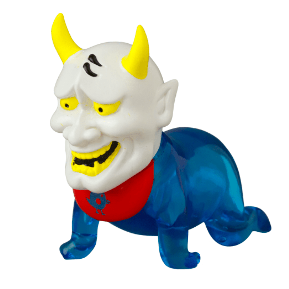 The VAG 10th Anniversary — Sebastian by Medicom (JP) is a Japanese vinyl toy featuring a demonic white head, yellow horns, sharp teeth, blue body, and red bib, standing on all fours against a white background.