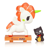 A Tokidoki Sushi Unicorno Blind Box toy unicorn and a cat on a wooden base.