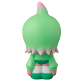 The VAG 43 — Kae Chan V3 by Medicom (JP) features a green cartoon figure with a rounded head, pink-tipped hair, and white socks, kneeling away from the viewer on a white background, evoking playful Japanese vinyl art toys.