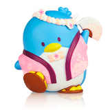 A colorful tokidoki toy penguin with a floral design and wearing a headband and sandals, from the Hello Kitty X Tokidoki - Series 3 Blind Box.