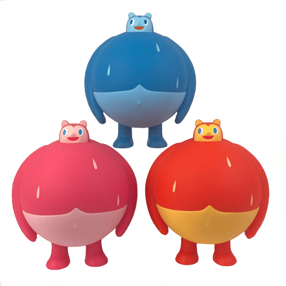 Three Heavy Cream Sugar Booger vinyl figures in different colors standing next to each other.