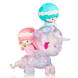 Two whimsical, translucent figurines from the tokidoki Hello Kitty X Tokidoki - Series 3 Blind Box: one resembling a child riding on a snail and the other a child sitting atop a lamb.