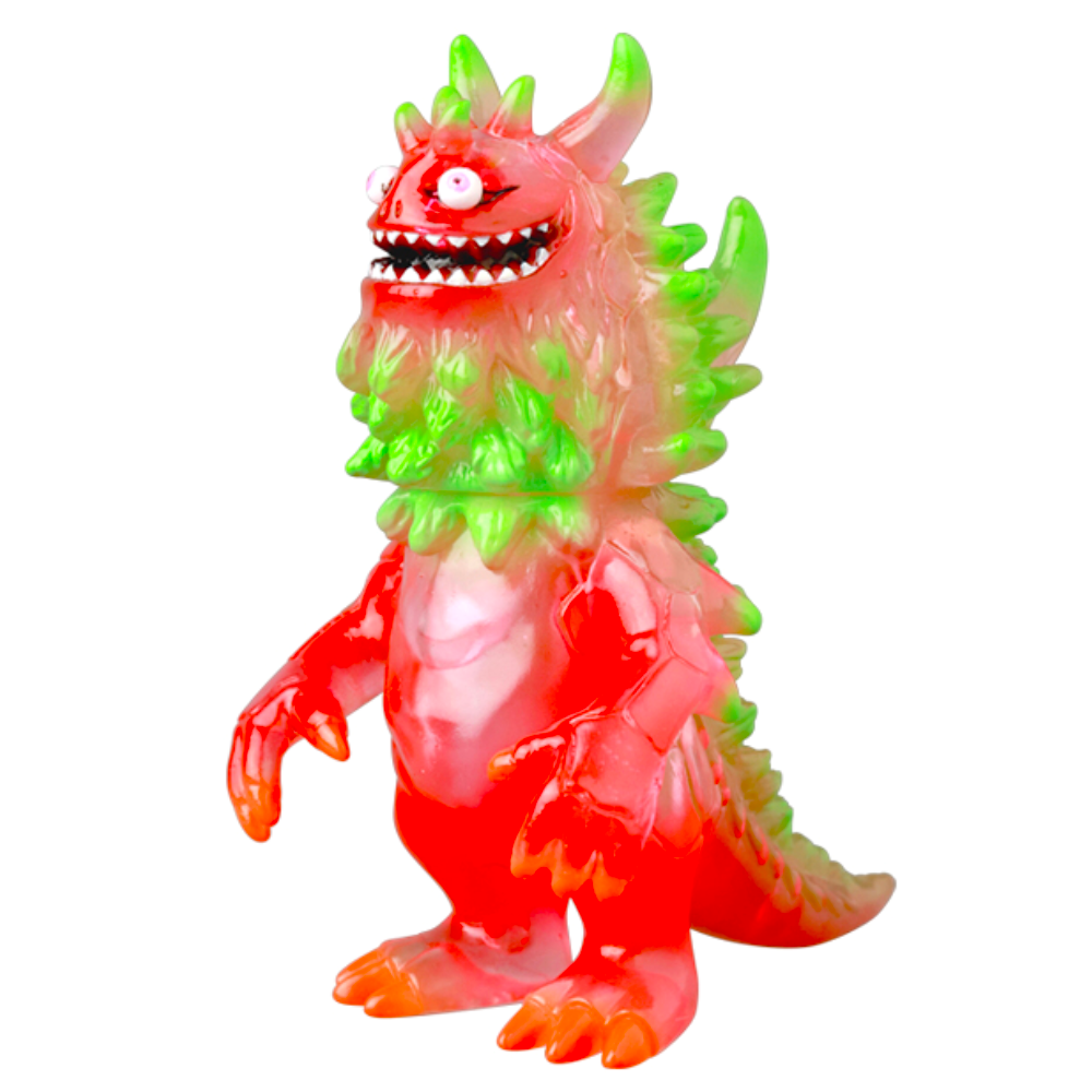 The Medicom (JP) VAG 10th Anniversary — Rangeas is a colorful Japanese vinyl toy monster with a translucent red, green, and orange body, spiky back, big eyes, sharp teeth, and claws. Ideal for gachapon figure collectors.