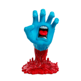 The Kidrobot (US) Screaming Hand 40th Anniv. Glow Art Figure features a blue hand with a mouth in its palm rising from a red melted base; it glows in the dark, showing teeth and a red tongue for a striking effect.