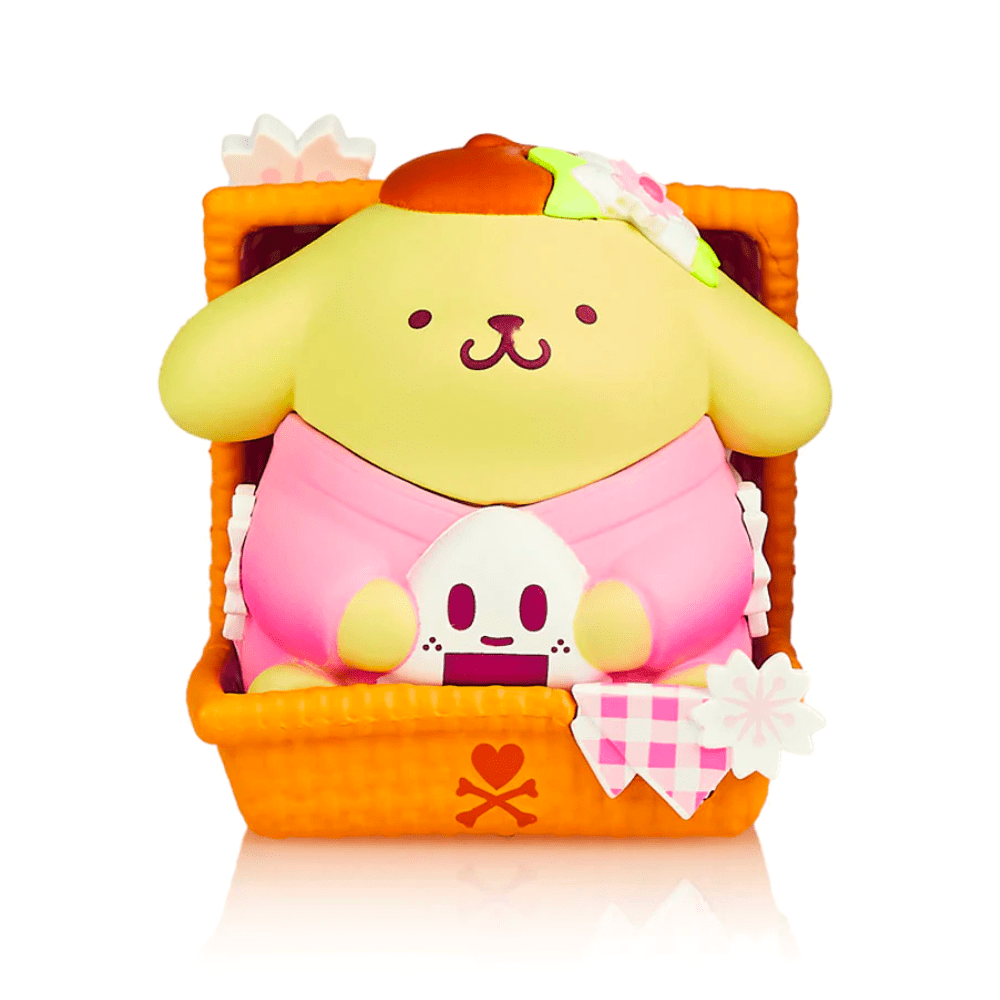 A colorful and cute plush toy from the Hello Kitty X Tokidoki - Series 3 Blind Box, featuring a cartoon-style dog wearing a hat, sitting in a basket.