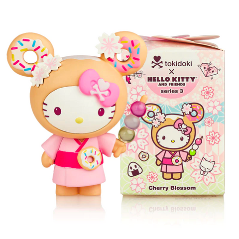 Hello Kitty X tokidoki Series 3 Blind Box figurine dressed in pink with donut-themed ears alongside its packaging.