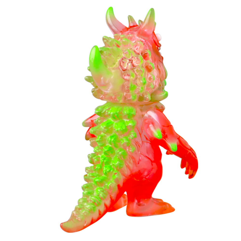 The Medicom (JP) VAG 10th Anniversary — Rangeas is a translucent Japanese vinyl toy monster with spikes, featuring red, green, and clear colors, shown in side view against a white background.