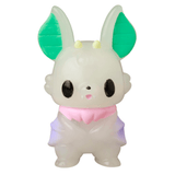 The VAG 10th Anniversary — Kopatapatan by Medicom (JP) is a small, cartoon-like Japanese vinyl toy figure featuring large green ears, black eyes, a pink collar, and a light purple and white body.