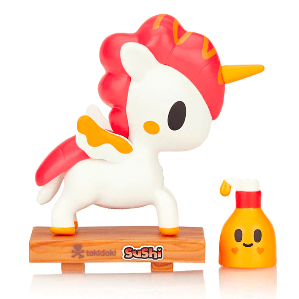 A Tokidoki Sushi Unicorno Blind Box toy is next to a bottle of shampoo.