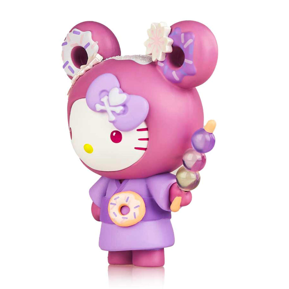 A Tokidoki x Hello Kitty Series 3 figurine dressed in a purple outfit with an ube donut, depicted in a stylized Tokidoki mouse theme.