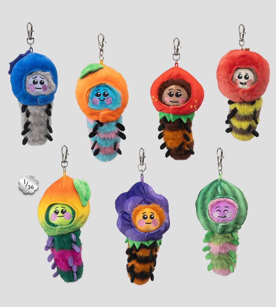 The Kaleidos Creative Wooly Bear and Friends Plush Keychain Blind Box features seven collectible caterpillar figures, each wearing a unique fruit or flower hat, displayed against a simple background.