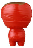 The Medicom (JP) VAG 41 — Yummy Mummy is a red Japanese vinyl toy reminiscent of gachapon figures, wrapped in molded red tape and shown from the back with a round head and short legs.