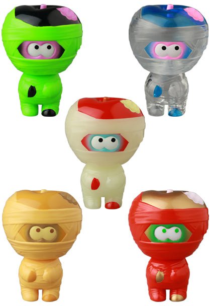 Five vibrant cartoon-style VAG 41 — Yummy Mummy figures by Medicom (JP), each wrapped like a mummy with expressive eyes, are clustered together on a white background.
