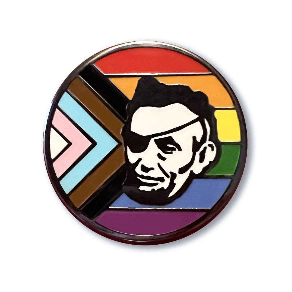 A Rotofugi Abe Progress Pride Hard Enamel Pin with an image of Abraham Lincoln, showing support for the LGBTQ+ community.
