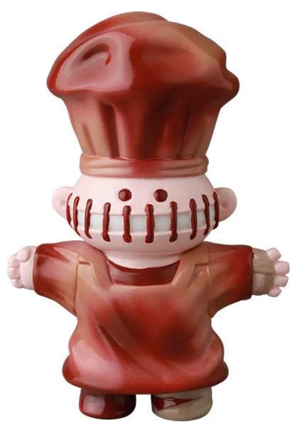Medicom (JP)'s VAG 39 — Butcher is a cartoonish chef vinyl figurine with a big hat, outstretched arms, vertical face stitching, and red-brown attire—perfect for Japanese collectible fans who love Vinyl Artist Gacha gachapon figures.