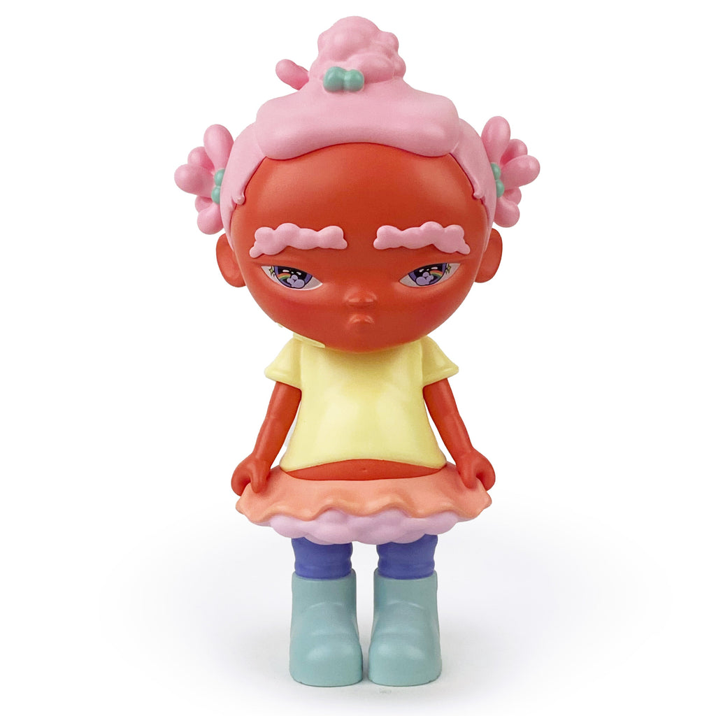 Binky — OG by Rotofugi is a limited edition art toy: a Black girl resin figure with pink hair and eyebrows, orange-red skin, yellow top, ruffled skirt, and blue boots—showcasing Bianca Pastel's style on a white background.