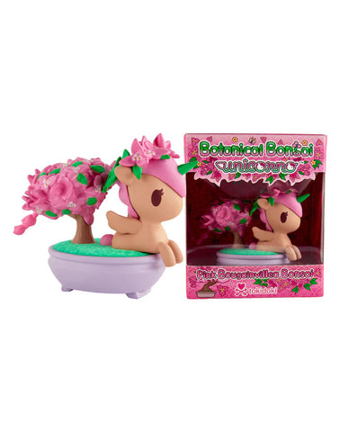 The tokidoki Botanical Bonsai Unicorno - Pink Bougainvillea Bonsai (Special Edition) features a pink Unicorno figurine with a bonsai tree in a purple pot, shown next to its pink floral box and capturing the essence of Pink Bougainvillea.