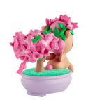 The tokidoki Botanical Bonsai Unicorno - Pink Bougainvillea Bonsai (Special Edition) features a small Unicorno figurine with a pink flower crown beside pink bougainvillea blossoms in a round purple pot.