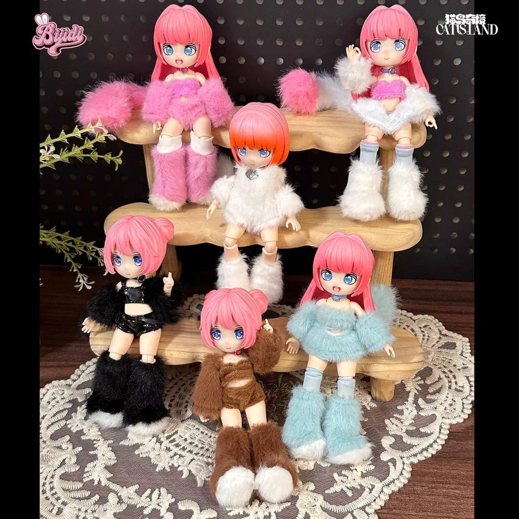 Six stylish Cat Island — Black Cat Or Candy Cat? Blind Box dolls by BIJIDI, each with pink hair and big blue eyes, wear colorful fluffy outfits and are displayed on a tiered wooden stand—cute surprises perfect for any blind box collection.