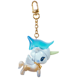 Introducing the tokidoki Forest Fairy Calla Lily Special Edition Unicorno Keychain—a whimsical accessory from our Forest Fairies Collection. This keychain features a charming unicorn figure with a blue mane, green horn, golden hooves, and a gold chain and clasp, all inspired by enchanting fairy motifs for a playful and magical touch.
