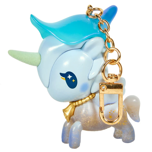 Here’s a rewritten sentence using the provided product data: The tokidoki Forest Fairy Calla Lily Special Edition Unicorno Keychain features a blue gradient mane, gold horn, gold collar, and sparkly legs. Adorned with a star and moon design near its eye and finished with a gold keychain clip on its neck, this enchanting accessory is perfect for fans of fairy-inspired designs.