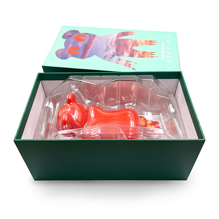 A box with a red Creeping Dero — Original vinyl toy mouse by Jermaine Rogers (US) in it.