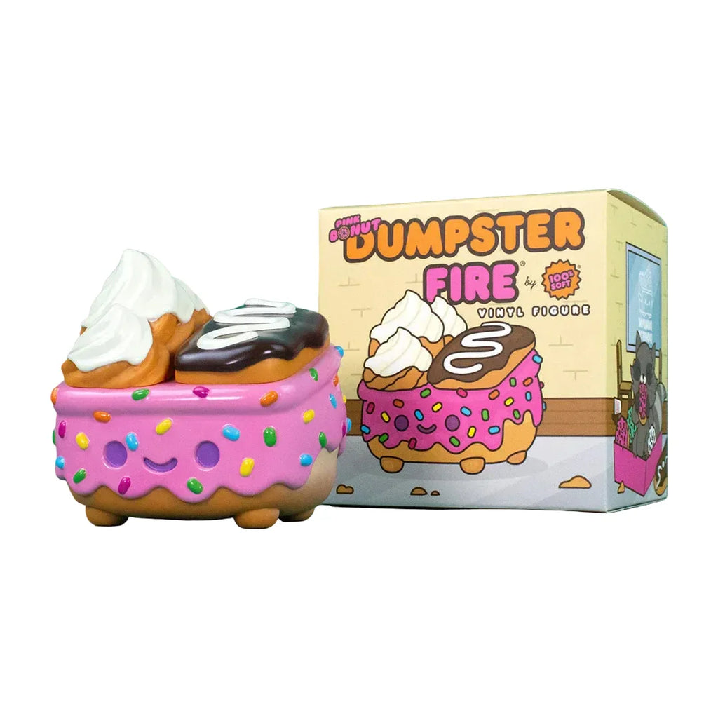 The 100% Soft Dumpster Fire - Donut Pink Vinyl Figure, shaped like a smiling pink dumpster decorated as a frosted donut with sprinkles, is displayed in front of its matching box.