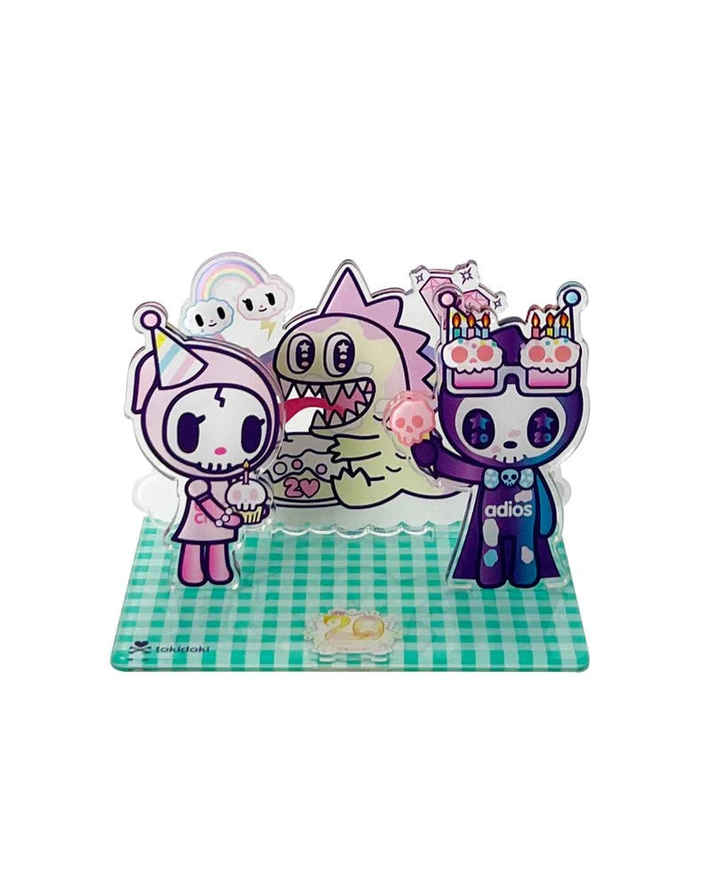 Celebrate Tokidoki’s 20th Anniversary with the Acrylic Standee Blind Box—each features three cute characters with cakes and party hats on a checkered base. Perfect for fans and collectors!.