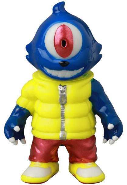 The Medicom (JP) VAG 41 — Gyaromioid is a blue cyclops toy with a red eye, yellow puffer jacket, red pants, and yellow shoes, inspired by Japanese vinyl art and shown against a white background.