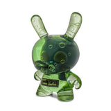 The Kidrobot (US) Infected Specimen Dunny 8” GID Art Figure (LE 600) is a translucent green vinyl bunny with internal bubbles and an upright stance, featuring a nameplate on its chest.