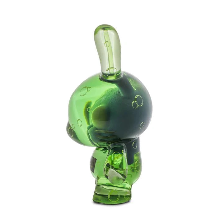 The Kidrobot Infected Specimen Dunny 8” GID Art Figure (LE 600) is a translucent green collectible with bunny-like ears, a round head, and bubble patterns, standing upright and facing slightly left.