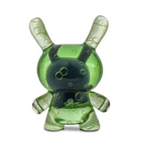 The Kidrobot (US) Infected Specimen Dunny 8” GID Art Figure (LE 600) features a green, translucent body with bunny-like ears and bubble patterns, displayed on a white background.