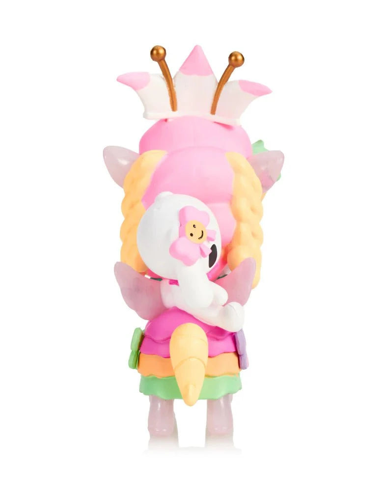 The Tokidoki Harajuku Princess Unicorno - Tanoshii Special Edition features a pastel design with braided hair, wings, a crown, and holds a white teddy bear—an irresistible kawaii collectible from Tokidoki, shown from the back.