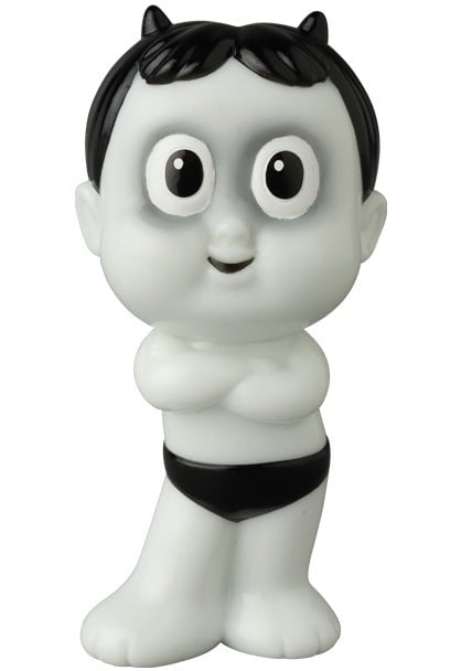 The VAG 42 — HAPY by Medicom is a quirky, cartoonish white figurine with black hair, small horns, big round eyes, and black briefs—evoking the playful style of Japanese vinyl toy and gachapon figures.