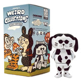 A spotted dog figurine stands beside a colorful