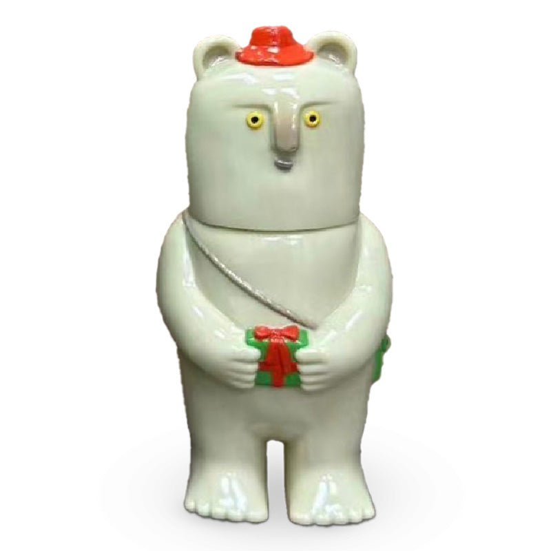 A Kurichan — Christmas 2023 figurine from Paradise Toy (TW), featuring a white bear wearing a red hat and holding a green gift box with a red ribbon. The bear has yellow eyes and a neutral facial expression.