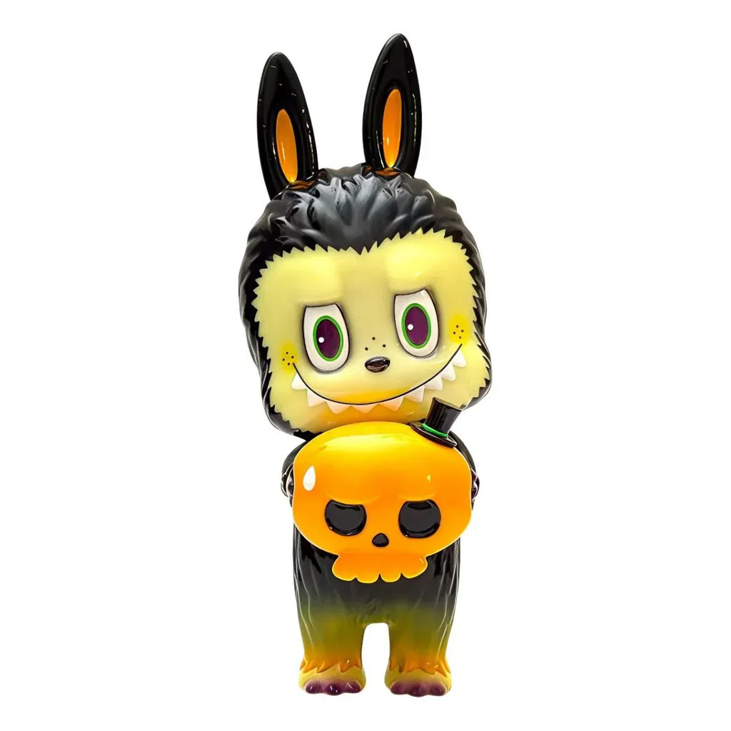 The Labubu - Halloween by How2Work (HK) is a charming collectible figurine featuring a cartoonish character with black bunny ears in a fluffy suit, holding an orange pumpkin-shaped object with a skull face.