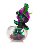 A small Tokidoki Neon Reef Mermicorno - Deep Star Coral Special Edition figurine stands in a clear bowl filled with black and red objects and green plant shapes.